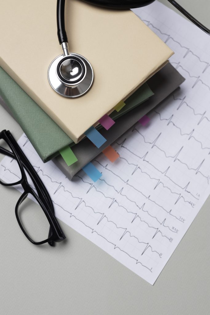 files next to glasses